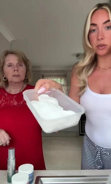 Woman showing a skincare hack with her grandmother.