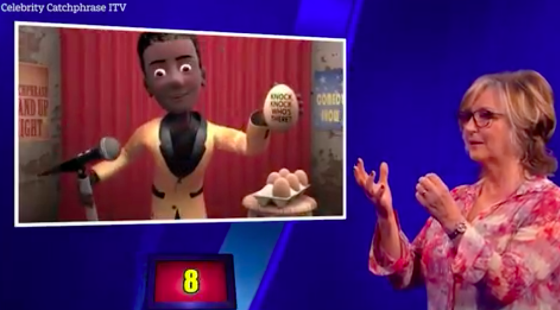Screenshot of Celebrity Catchphrase game show: an animated character holding eggs and a woman gesturing.