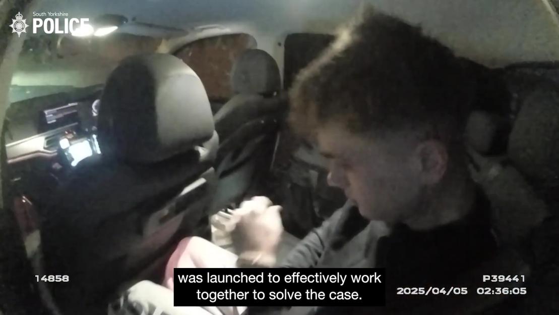Screengrab from police video showing a driver inhaling laughing gas before an accident.