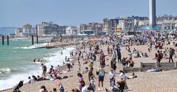 Crowded Brighton beach on a sunny day.