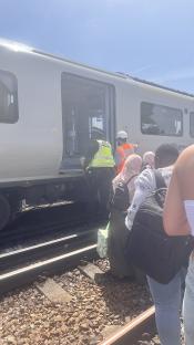 Passengers disembarking a broken-down Thameslink train.