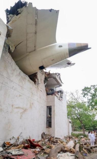 Debris of a plane crash into a building.
