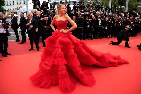 Zara McDermott in a red gown at the Cannes Film Festival.