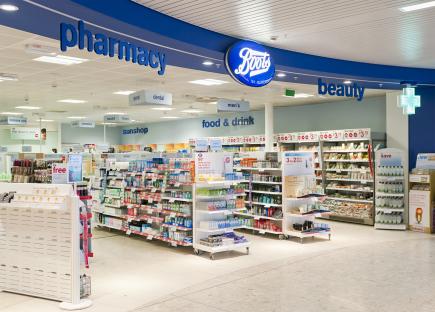 Interior view of a Boots pharmacy and beauty shop.