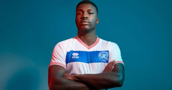 Portrait of Kiyan Prince in a Queens Park Rangers football shirt.