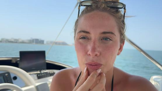 Saffron Barker on a boat, appearing emotional.