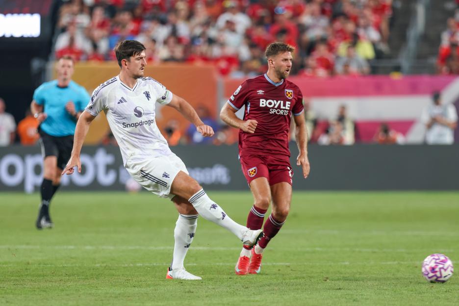 Harry Maguire #5 of Manchester United passes the ball.