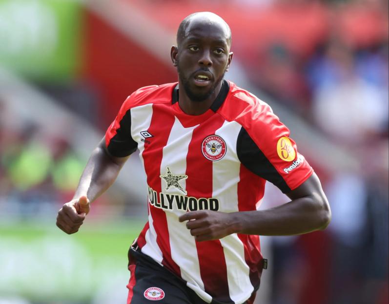 Yoane Wissa of Brentford FC running on the soccer field.