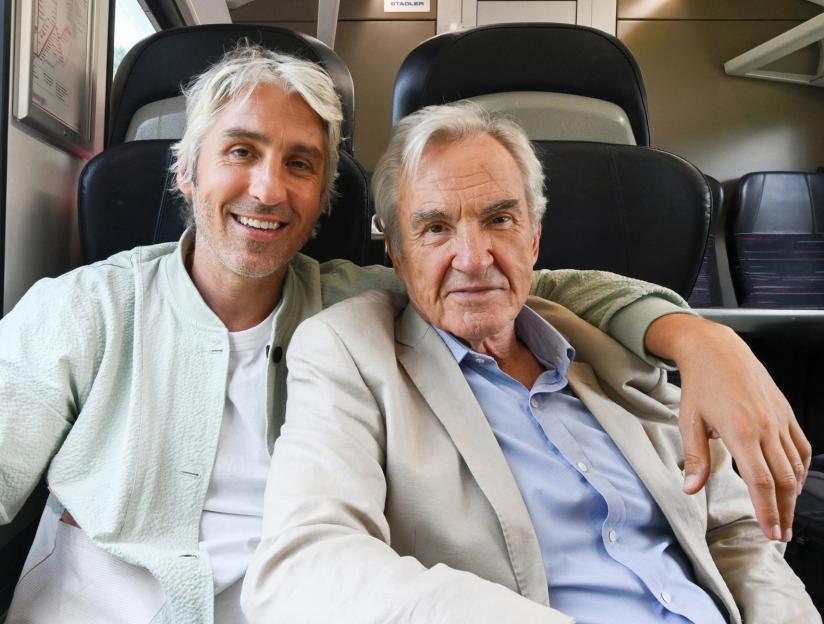 Larry and George Lamb on a train.