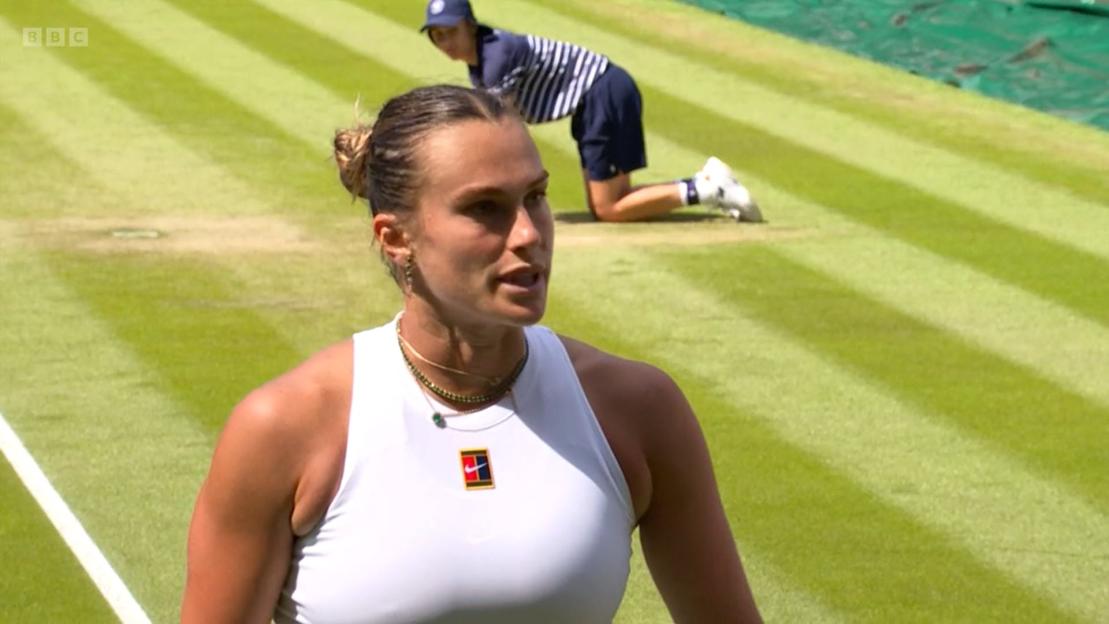 Aryna Sabalenka on a tennis court.
