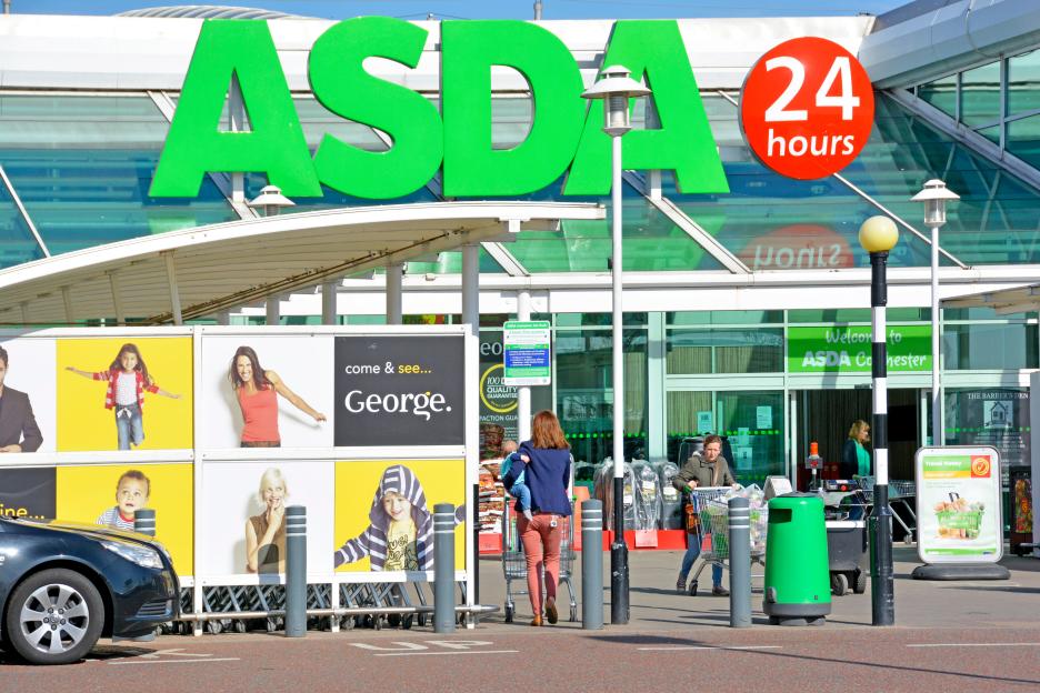 Exterior view of an Asda supermarket with shoppers at the entrance.