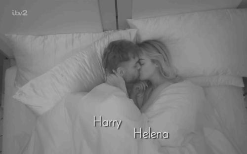 Harry and Helena kissing in bed.