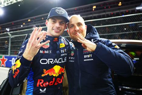Max Verstappen and his race engineer celebrating a Formula 1 victory.