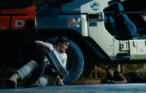 Film still of Rupert Friend and Scarlett Johansson in Jurassic World: Dominion.