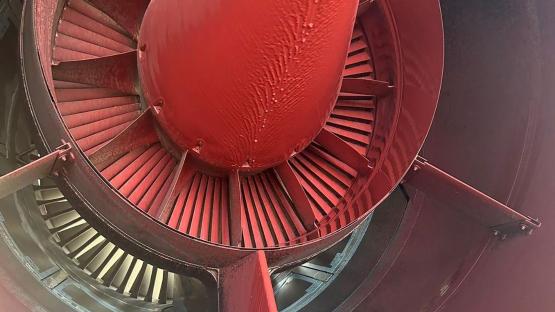 Close-up of a vandalized military aircraft engine.