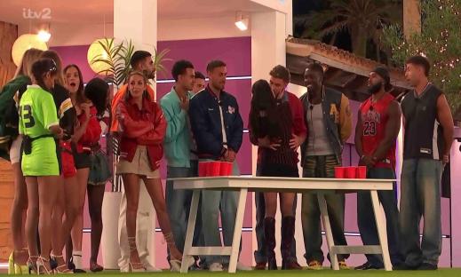 Islanders playing beer pong.