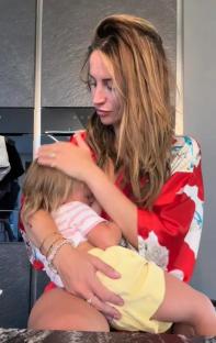 Woman breastfeeding toddler.