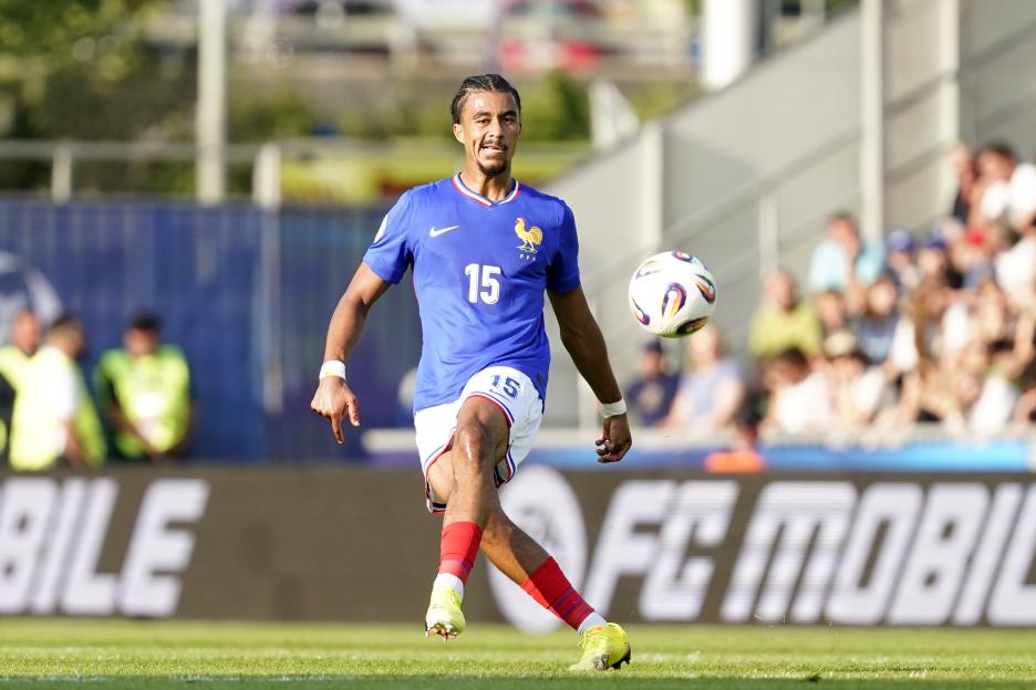 Nathan Zeze of France U21 kicks a soccer ball during a match.