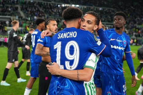 Jadon Sancho of Chelsea embraced by Antony of Real Betis after a soccer game.