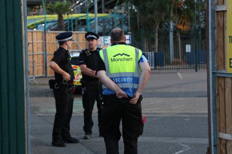 Police officers and security personnel at a music festival.