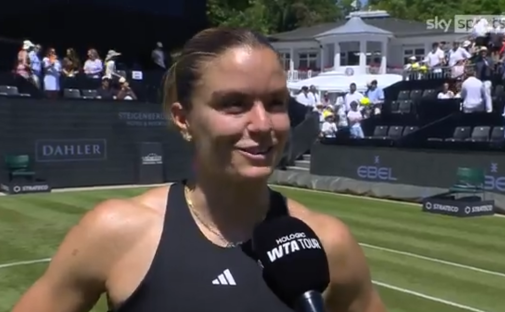Tennis player being interviewed on a court.