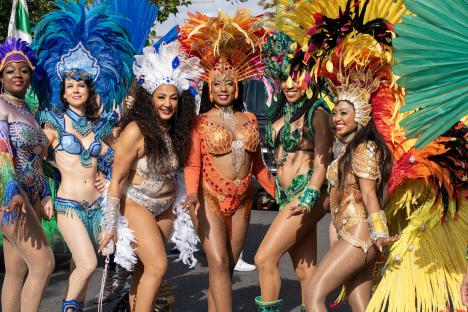 Women in elaborate costumes at the Notting Hill Carnival.