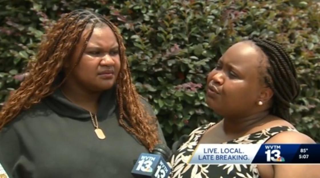 Two women being interviewed about a missing person.