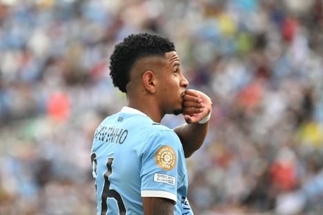 Manchester City's Savinho celebrating a goal.