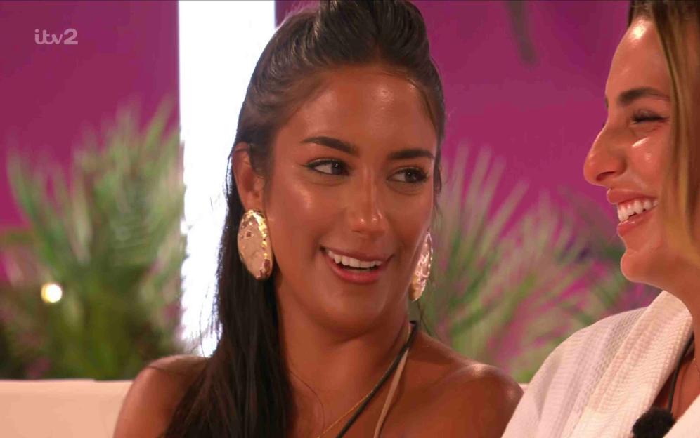 Screenshot from Love Island showing two women smiling.