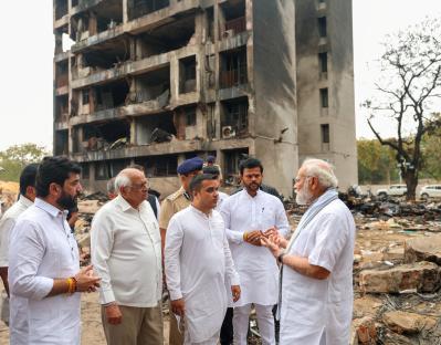 Prime Minister Narendra Modi at the site of a plane crash.