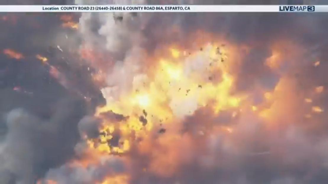 Massive explosion destroying a fireworks warehouse.
