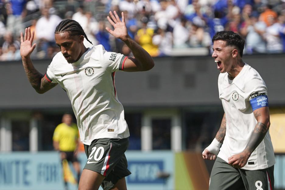 Joao Pedro and Enzo Fernandez celebrating a goal.