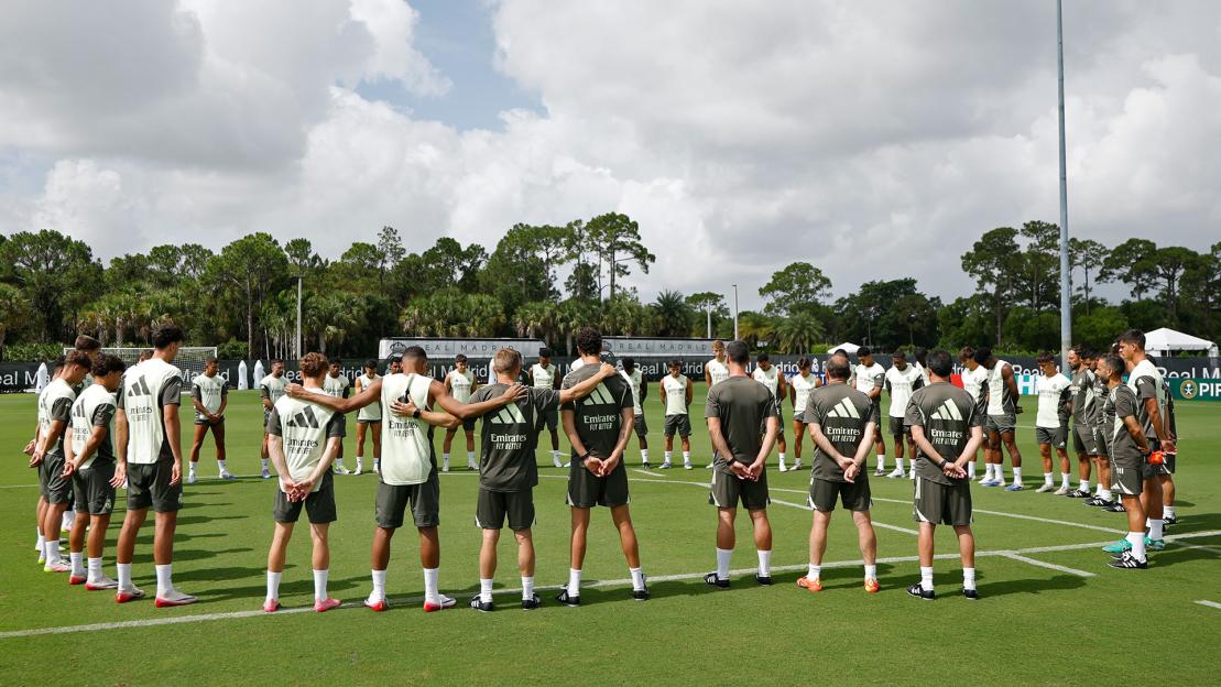 Real Madrid players holding a moment of silence.