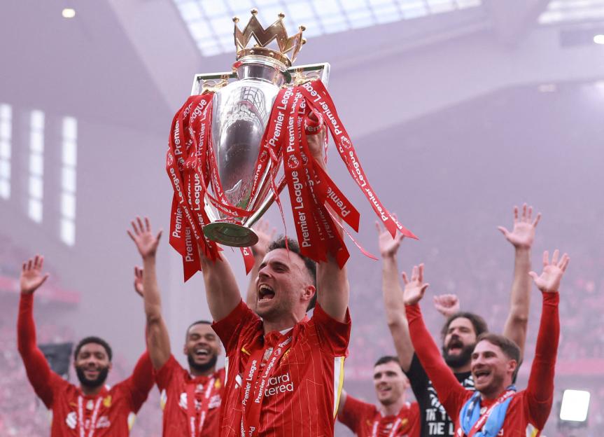 Diogo Jota of Liverpool lifts the Premier League trophy.