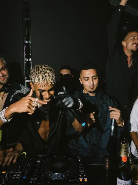 Lamine Yamal DJing at a party.