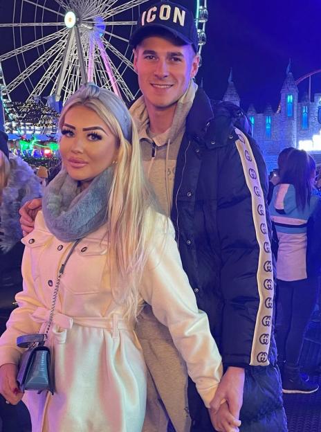 Blue Stevens and his girlfriend holding hands.