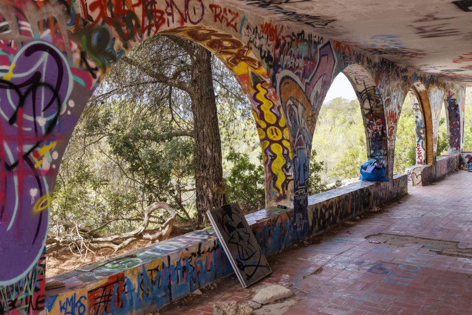 Graffiti-covered archway of abandoned Ibiza super club.