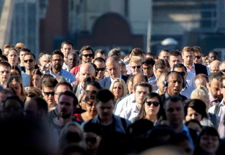 Commuters crossing London Bridge.