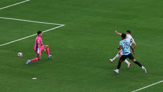 Dusan Vlahovic scoring a goal during a soccer match.