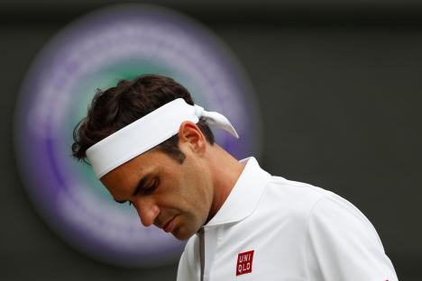 Roger Federer reacting after a point at Wimbledon.