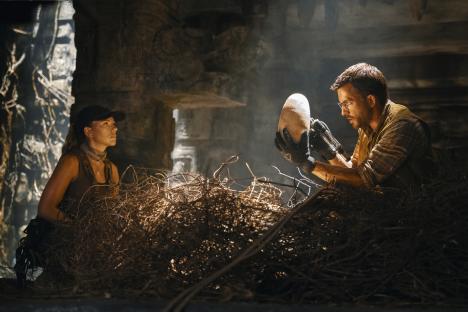 Scarlett Johansson and Jonathan Bailey in a scene from Jurassic World: Dominion.