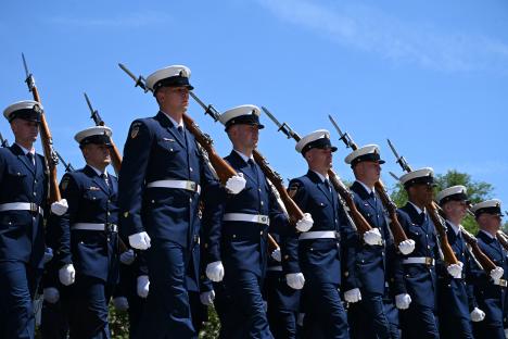 US Coast Guard members marching in a parade.