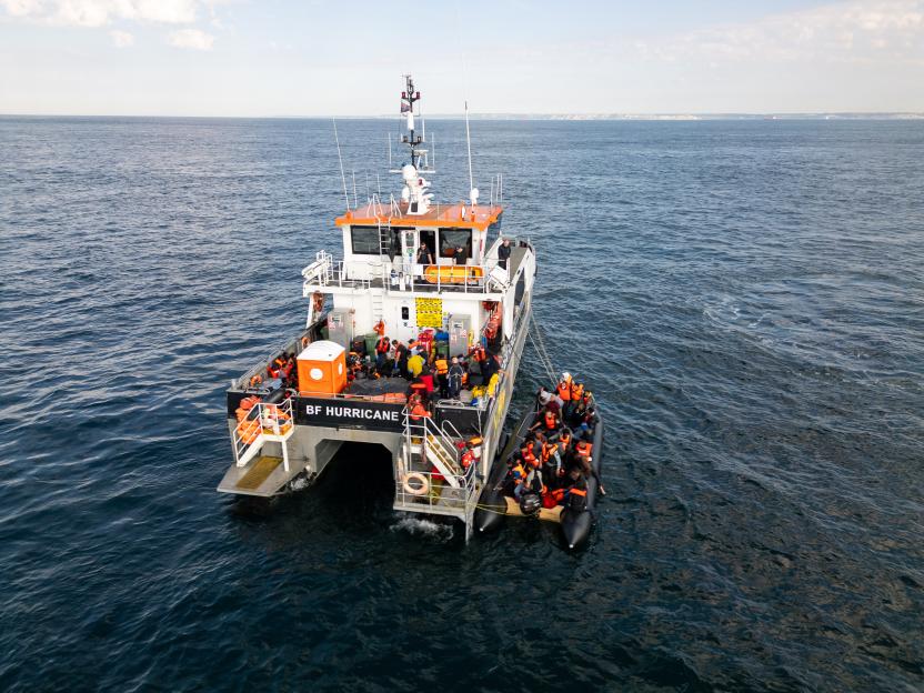A rescue boat assisting migrants at sea.