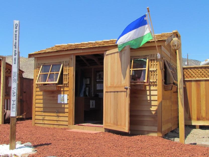 Wooden shed with Molossia flag.