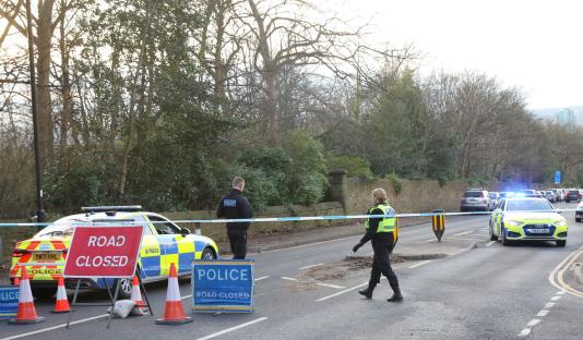 Police at a road closure.