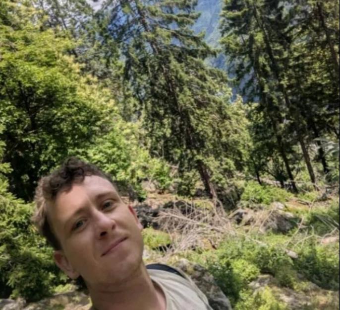 A man hiking in the Italian Alps.