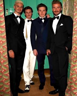 Four men in formal wear.