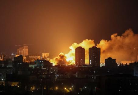 Fire and smoke over a city at night following a drone strike.