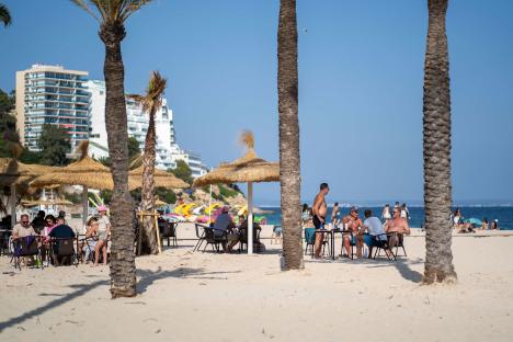 Spanish tourists at a beach in Magaluf.