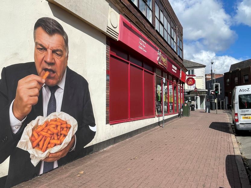 Mural of Sam Allardyce eating chips.